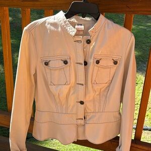 Women’s button up jacket with back seams and button detail on waist and sleeves